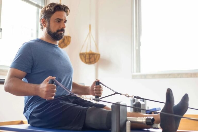 Physical therapist working with a patient at Omega Physical Rehab